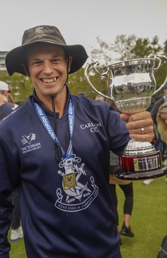 Carlton captain Evan Gulbis comes to grips with the premiership cup. Picture: Valeriu Campan