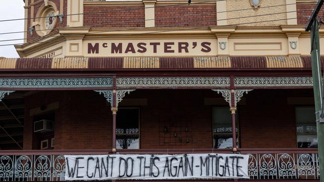 Signs calling for better management of Lake Eppalock hung around the town. Picture: Jason Edwards