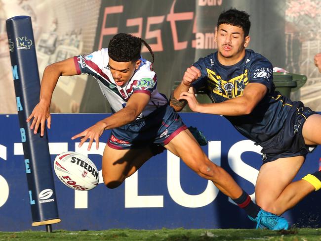 Xavier Kirk dives across the tryline to score for Ipswich. Picture David Clark