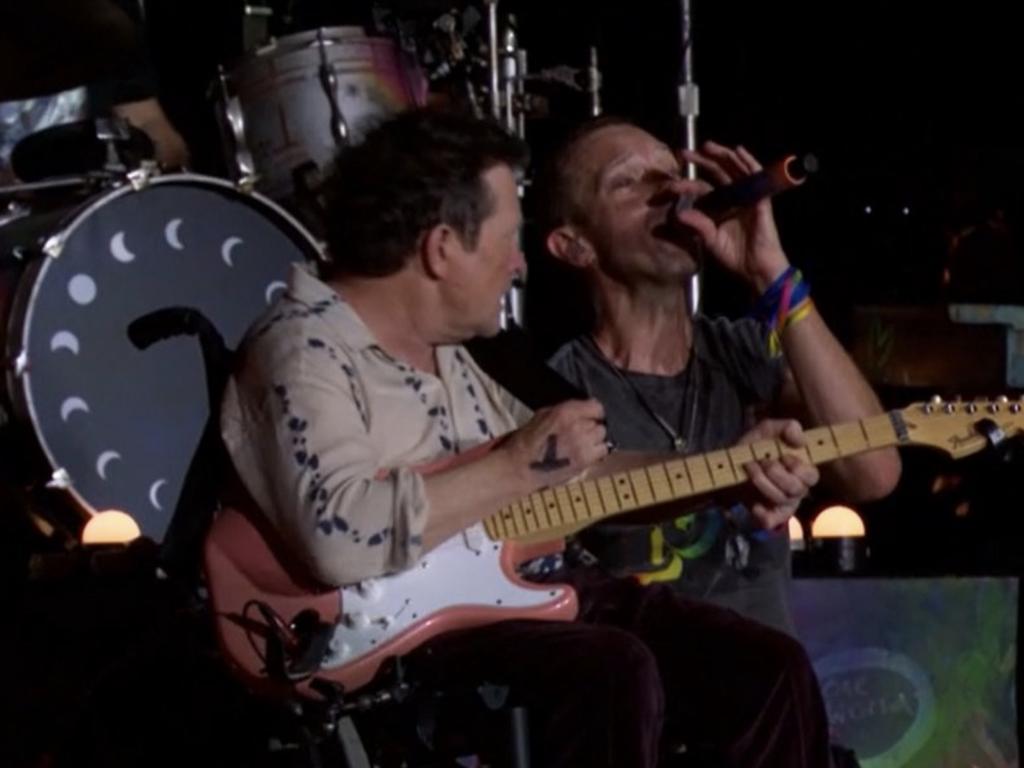 Michael J. Fox joined Martin onstage, electric guitar in hand.