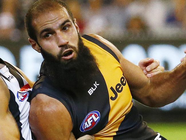 AFL - Round 2 - Collingwood v Richmond at MCG , Richmond's Bachar Houli gets tackled by Collingwood's Brent Macaffer. 1st April 2016. Picture: Colleen Petch.