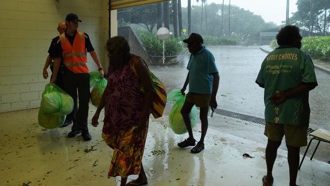 People seek shelter at the Supreme Court building. Picture: Keri Megelus