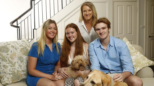 At home with her children Kate (17), Maeve (14) and James (18), and family dogs PJ and Bailey. Picture: John Appleyard