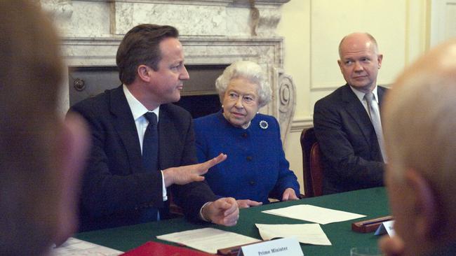 The late Queen Elizabeth II pictured with then Foreign Secretary William Hague, right, and then British Prime Minister David Cameron. Government was conducted in a rational, methodical way, says Hague. Picture: AFP