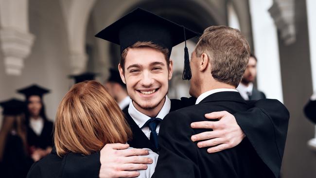 CAREERS. Parents congratulate the student, who finish their studies at the university. He graduates. They are very happy about this. University graduate. Picture: iStock