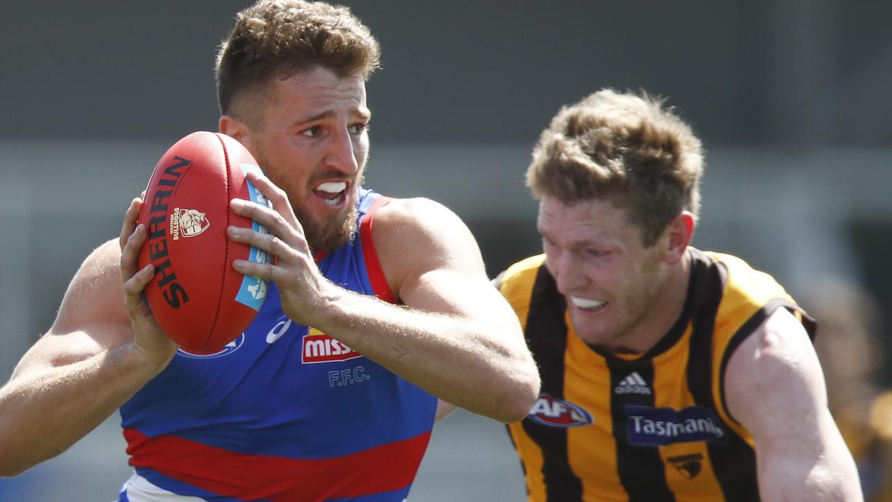 MELBOURNE, AUSTRALIA - Marcus Bontempelli of the Bulldogs is tackled by Ben McEvoy 2021 (Photo by Daniel Pockett/AFL Photos/via Getty Images)