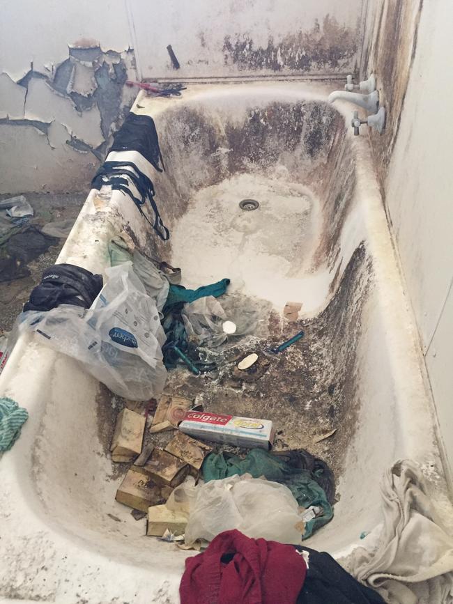 The bath in a trashed unit at Runaway Bay which Mr Van Lith cleaned.