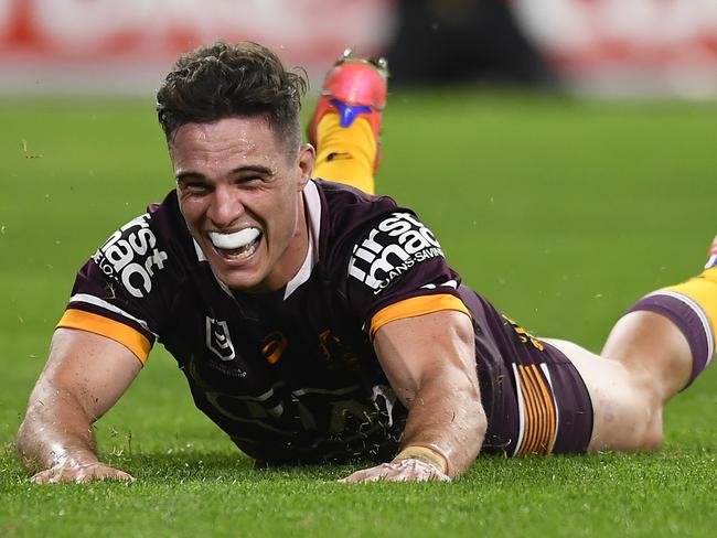 BRISBANE, AUSTRALIA - JULY 30: Brodie Croft of the Broncos scores a try during the round 20 NRL match between the Brisbane Broncos and the North Queensland Cowboys at Suncorp Stadium, on July 30, 2021, in Brisbane, Australia. (Photo by Albert Perez/Getty Images)