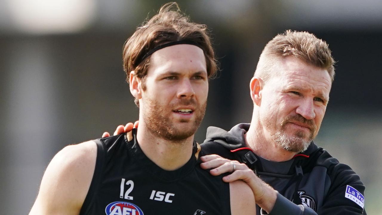 Magpies head coach Nathan Buckley hugs Matthew Scharenberg during a Collingwood training session at the Holden Centre in Melbourne, Wednesday, September 4, 2019. (AAP Image/Michael Dodge) NO ARCHIVING