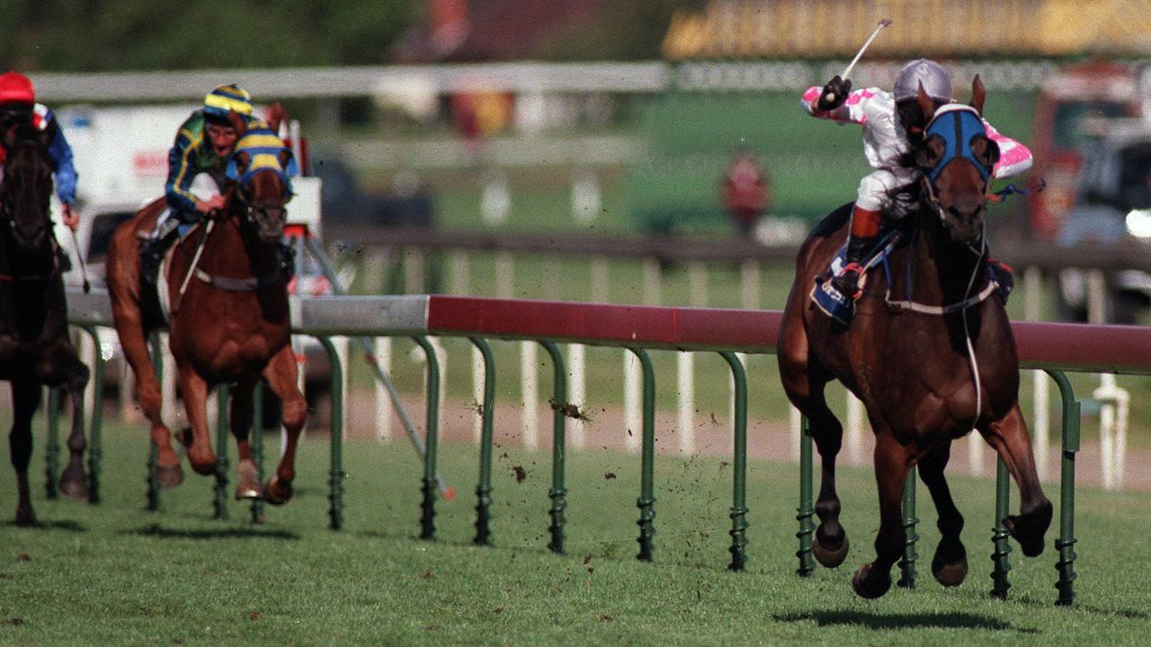 Racehorse Might And Power ridden by jockey Jim Cassidy winning 1997 Caulfield Cup, 18/10/97.
  Turf A/CT