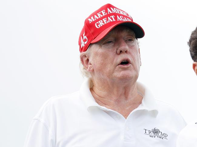 BEDMINSTER, NEW JERSEY - JULY 28: Former U.S. President Donald Trump and Yasir al-Rumayyan, head of the sovereign wealth fund of Saudi Arabia, look on from the second tee during the pro-am prior to the LIV Golf Invitational - Bedminster at Trump National Golf Club Bedminster on July 28, 2022 in Bedminster, New Jersey.   Cliff Hawkins/Getty Images/AFP == FOR NEWSPAPERS, INTERNET, TELCOS & TELEVISION USE ONLY ==