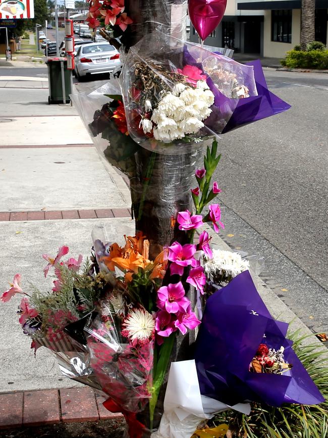 Flowers left at the scene where Haydn Butcher was punched. Picture: John Grainger