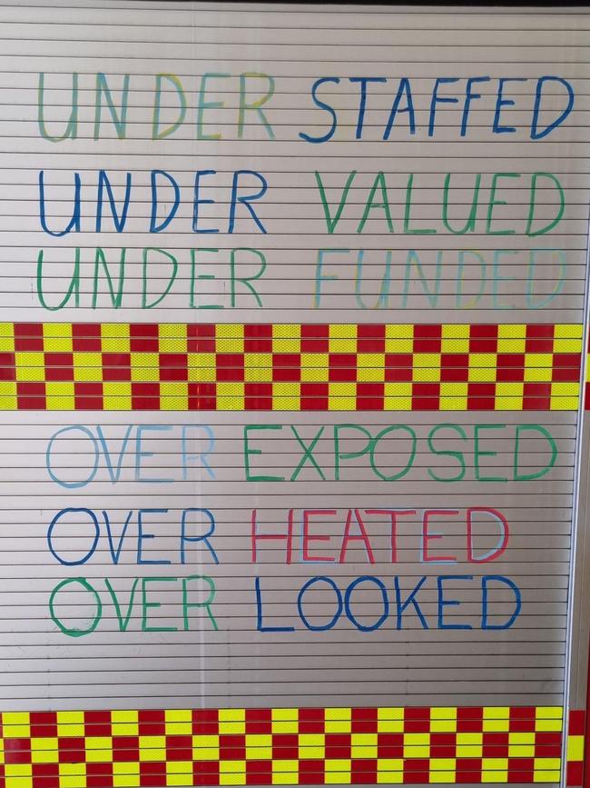 NT Firefighters have been writing slogans on their firetrucks as part of a protected industrial action during ongoing EBA negotiations. Picture: Supplied.