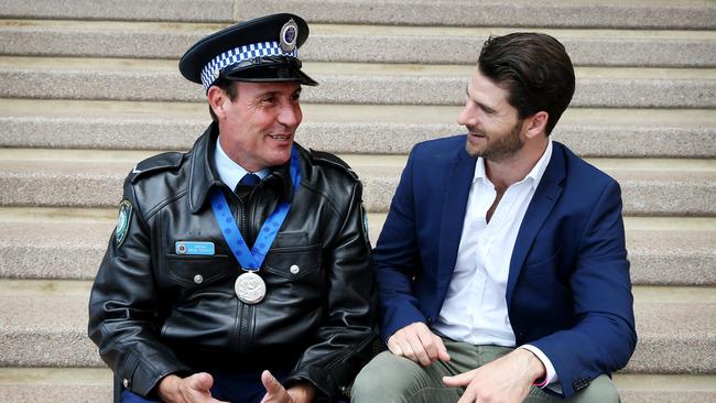 Police officer Arun Trevitt received an award for helping prevent Dan Price from jumping off the Sydney Harbour Bridge. Picture: Toby Zerna