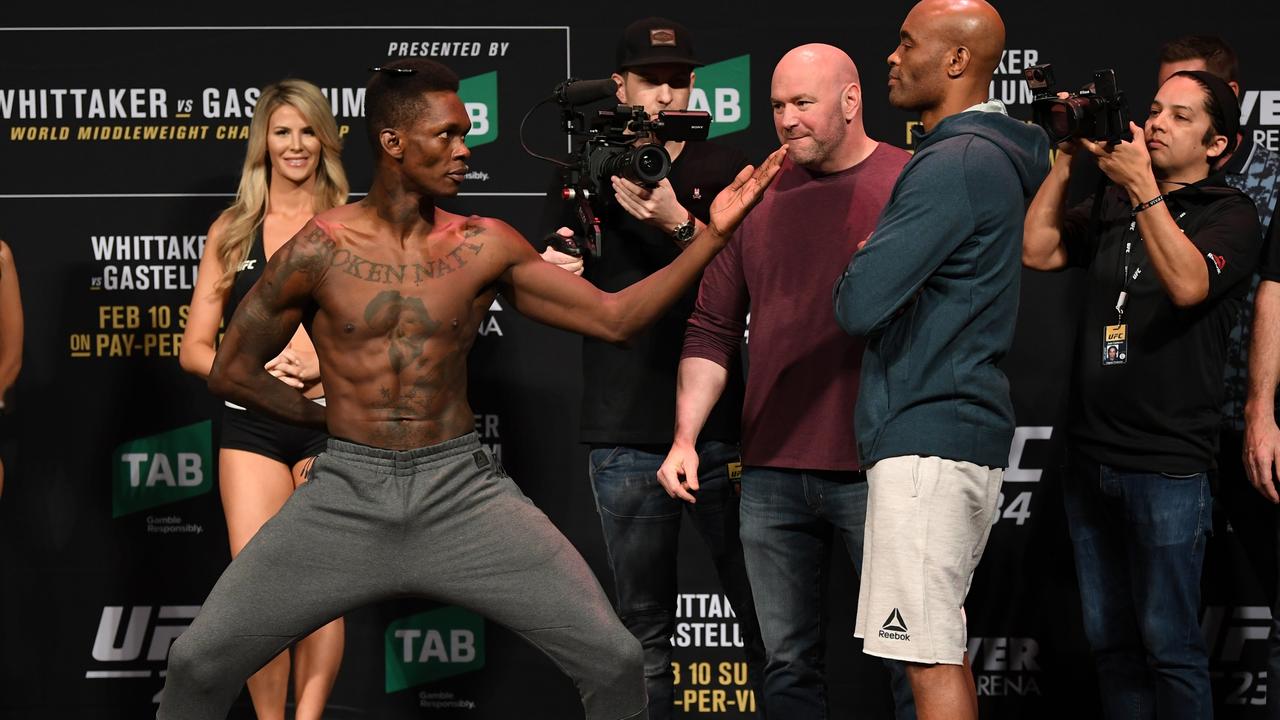 (L-R) Israel Adesanya of New Zealand and Anderson Silva of Brazil face ofF
