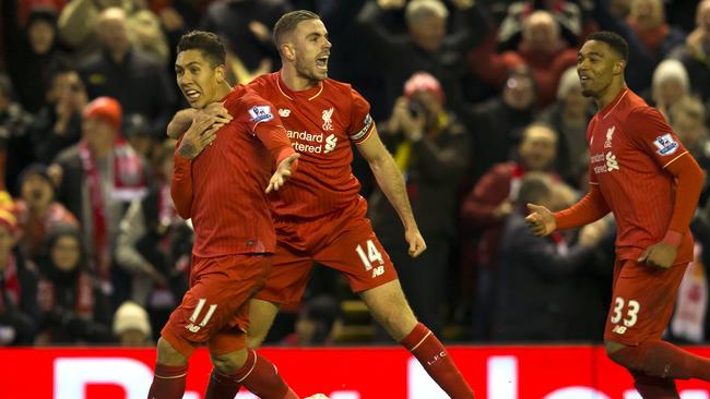 Liverpool's Roberto Firmino (L) celebrates a goal with Jordan Henderson and Jordon Ibe.