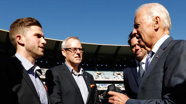 Marc Murphy hands then vice president Joe Biden a Calrton guernsey in 2106. Picture: Michael Willson