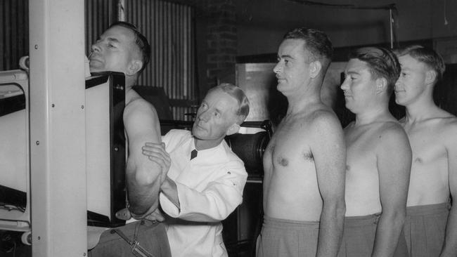 Workers at the old Kelvinator factory receive X-ray tests for tuberculosis.