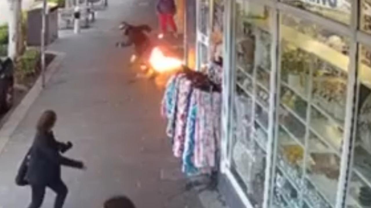 Horror moment shop allegedly set on fire
