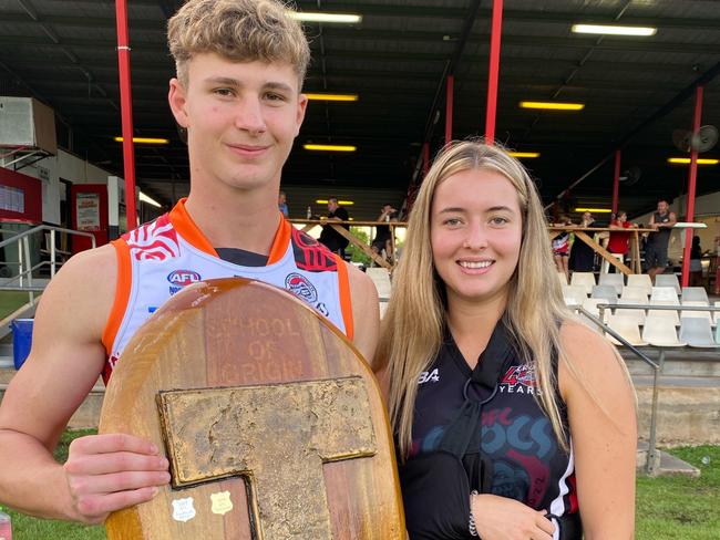 Bella Clarke, with her cousin and Thomas’ brother Patrick, with the “T for Thomas” trophy, which two local schools play for each year. Picture: Yvette Clarke.