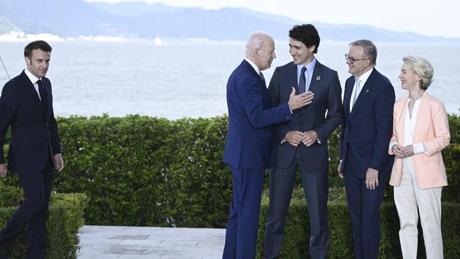 France's President, Emmanuel Macron, left, arrives as US President Joe Biden speaks with Canada’s Prime Minister, Justin Trudeau, Australia’s Prime Minister, Anthony Albanese and European Commission President, Ursula von der Leyen in Hiroshima, Japan. Picture: Getty Images