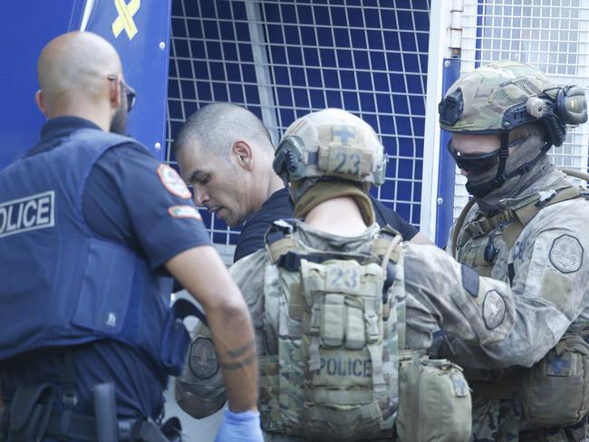 Shem Reece Rotumah is arrested following a six-hour siege in the heart of the Darwin CBD on Thursday. Picture Glenn Campbell