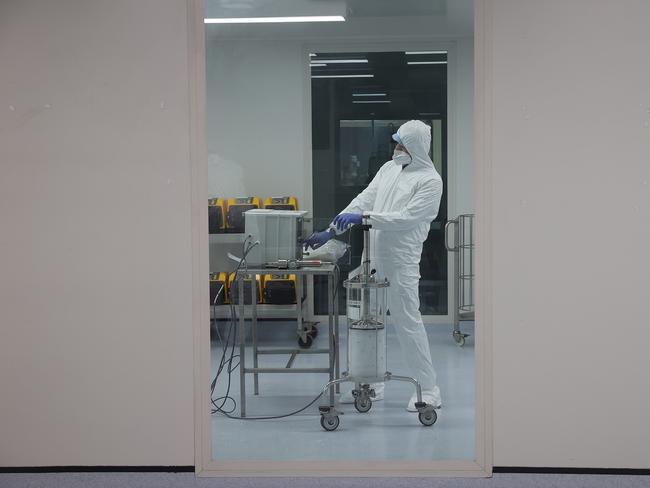 SYDNEY, AUSTRALIA - NCA NewsWire. September 22, 2020: Aegros employees with the ES-05 which is a ElectroSeparation processing machine. It efficiently separates the immune proteins from blood plasma for Covid-19 research. They are pictured at Aegros Ãs new Sydney biotech processing facility in Macquarie Parkin Sydney. Picture: NCA NewsWire / Dylan Coker