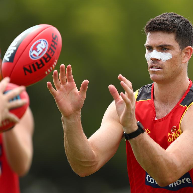 Sam Collins handballs during a Gold Coast Suns AFL media and training session at Metricon Stadium on November 04, 2019 in Gold Coast, Australia. (Photo by Chris Hyde/Getty Images)
