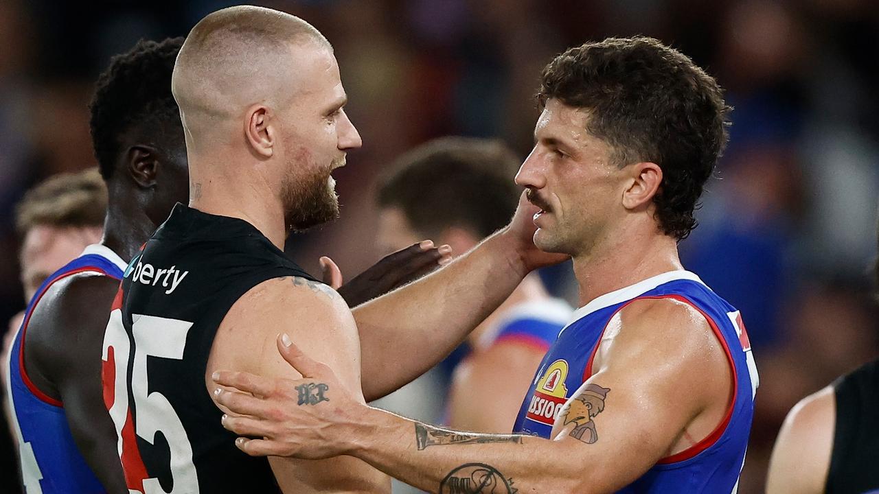 Jake Stringer (left) with former Bulldogs teammate Tom Liberatore after he starred in Essendon’s 29-point win last Friday. Picture: Michael Willson / Getty Images