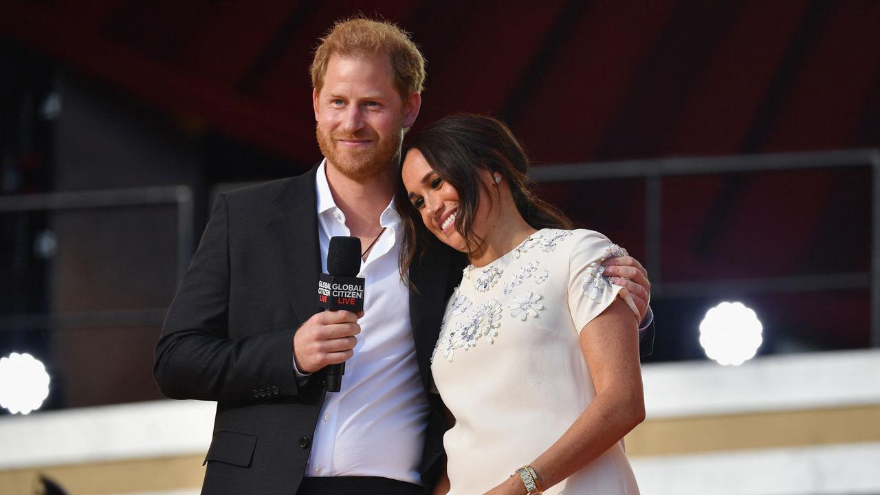 Meghan is digging in, but Harry is reportedly returning to his roots. Picture: AFP