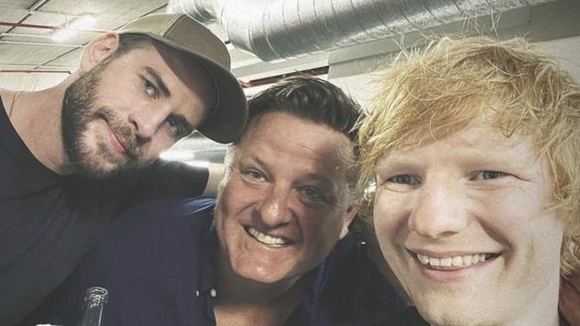 Liam Hemsworth and Ed Sheeran shared some birthday drinks with another friend backstage.