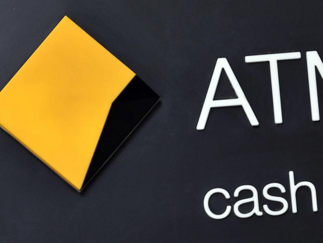 The logo of Australia's Commonwealth Bank is seen outside a branch in the central business district of Sydney on August 12, 2020. - Australia's Commonwealth Bank (CBA) reported an 11.3-percent drop in full-year cash profits as it took provisions against loan losses due to the COVID-19 coronavirus crisis. (Photo by Saeed KHAN / AFP)