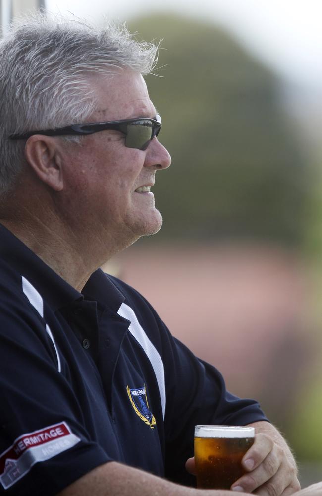 Geoff Richardson enjoys a cool drink as he watches Noble Park.