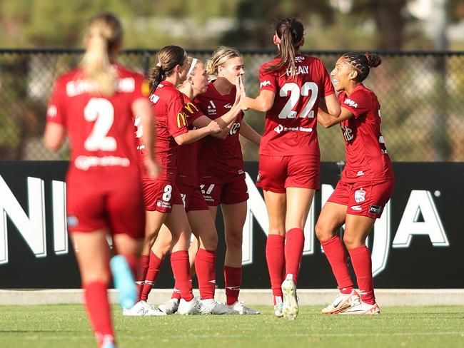 Adelaide United players celebrate Fiona Worts’ opening goal. Picture: Maya Thompson/Getty Images