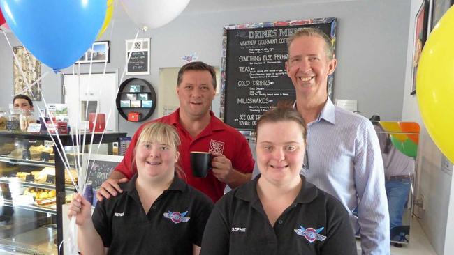 JOBS FOR ALL: Sunshine Coast social enterprise business Compass is setting a great example of how to engage people with disabilities in meaningful employment. Pictured at its Compass Connections Cafe are Matt Murray (Sunshine Coast's Best Used Cars), Compass CEO David Dangerfield and employees Renee and Sophie. Picture: Contributed.