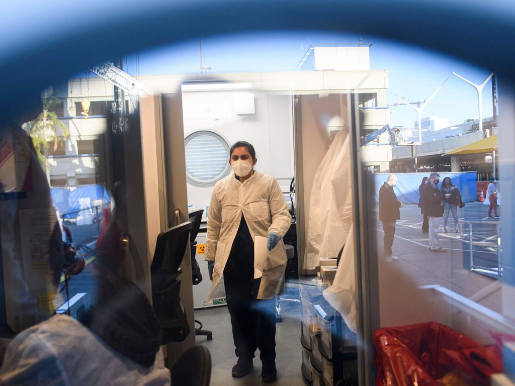 Lab staff process COVID tests at a lab in Los Angeles International Airport (LAX). Picture: AFP