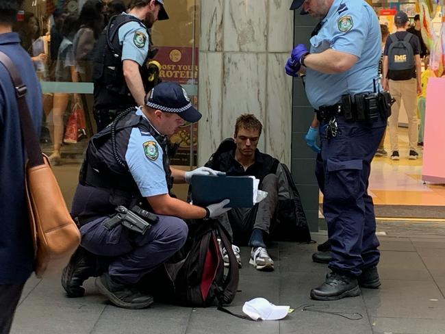 A man has been charged with common assault in an incident where shoppers were forced to pin him to the floor on Pitt St, Sydney. Picture: Tim Williams