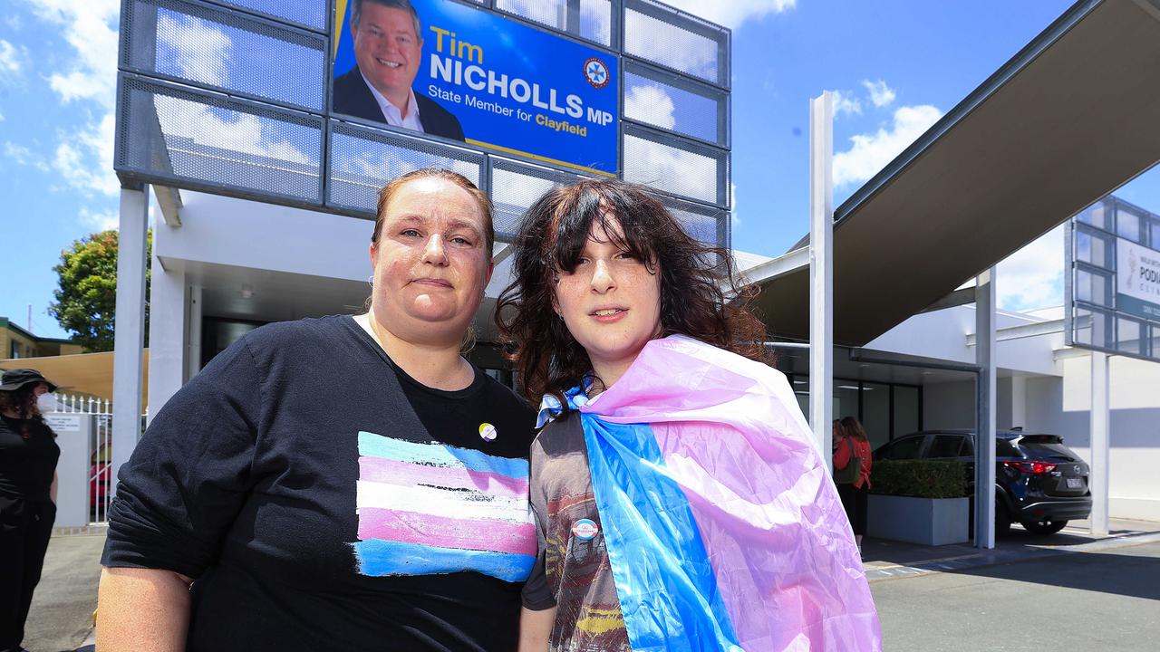 Hannah Redford with Vee 15 join protesters at Tim Nicholls Electorate office in a gathering organised by Magandjin Peoples Pride to protest the decision to stop puberty blockers. Photo: Adam Head