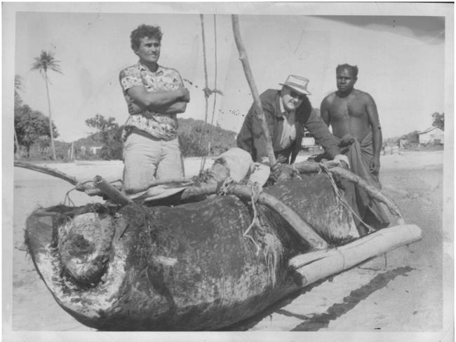 Michael Fomenko with his hand-carved dugout canoe.