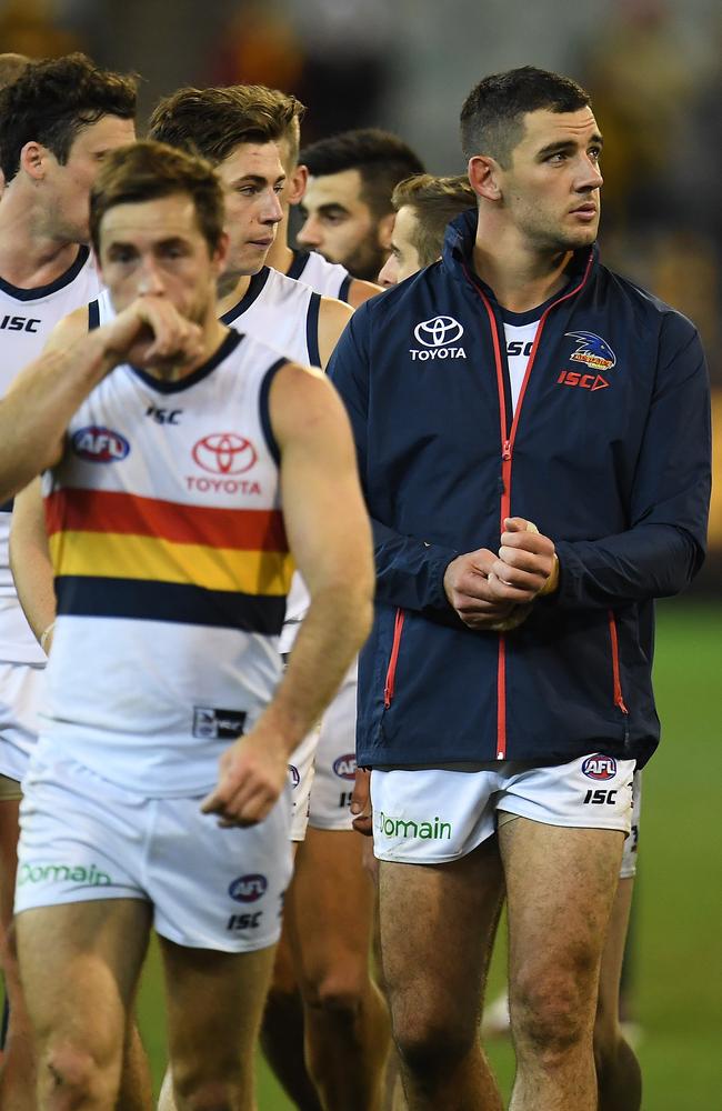 Taylor Walker of the Crows leads his players from the ground after the Round 13 loss to Hawthorn at the MCG. Picture: AAP Image/Julian Smith