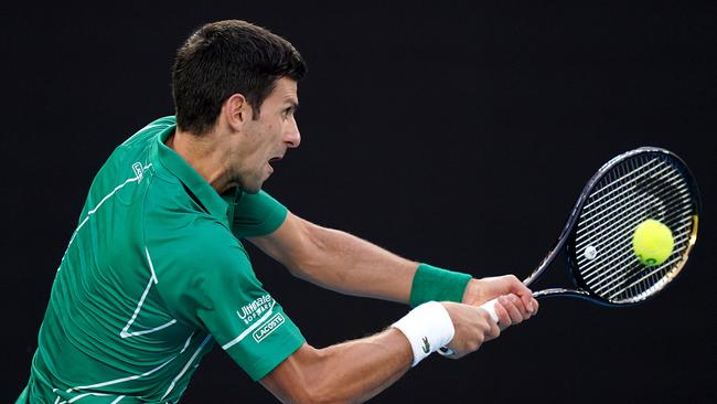 Novak Djokovic of Serbia plays a return shot