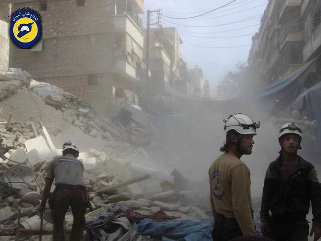 Workers from the Syrian Civil Defence group, known as the White Helmets, search through the rubble in rebel-held eastern Aleppo. Picture: Syrian Civil Defence — White Helmets via AP