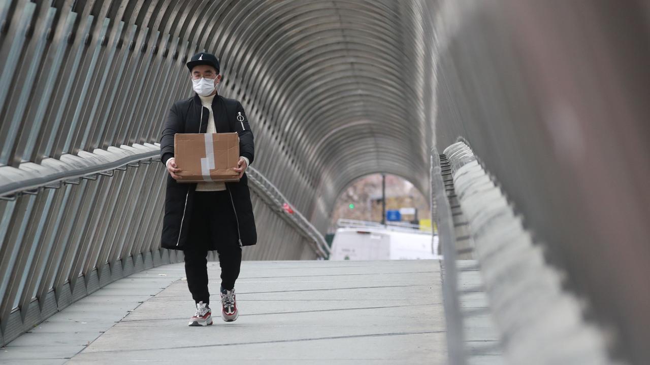 Despite earlier concerns, scientists said the chances of catching coronavirus from packages or mail is very low. Picture: Ludovic Marin/AFP