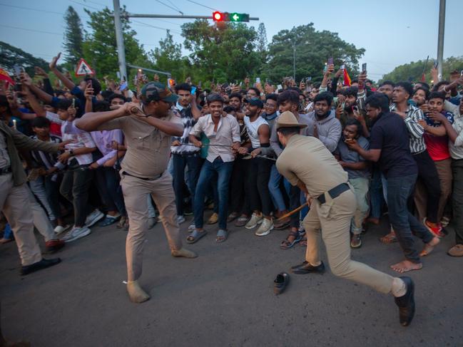 Police officers try to control fans. Picture: Abhishek Chinnappa/Getty Images