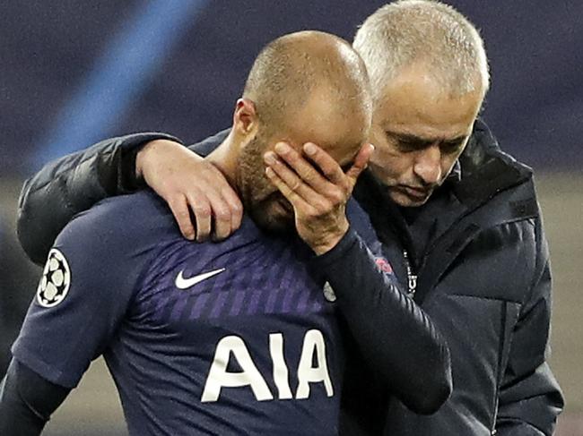 Tottenham's manager Jose Mourinho, right, comforts Tottenham's Lucas Moura after losing the Champions League round of 16, 2nd leg soccer match between RB Leipzig and Tottenham Hotspur in Leipzig, Germany, Tuesday, March 10, 2020. Leipzig defeated Tottenham with 3-0. (AP Photo/Michael Sohn)