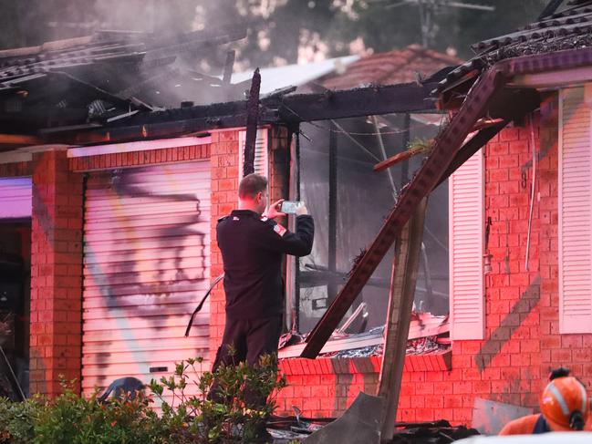 A fire investigator at the blaze scene Friday morning. Picture John Grainger