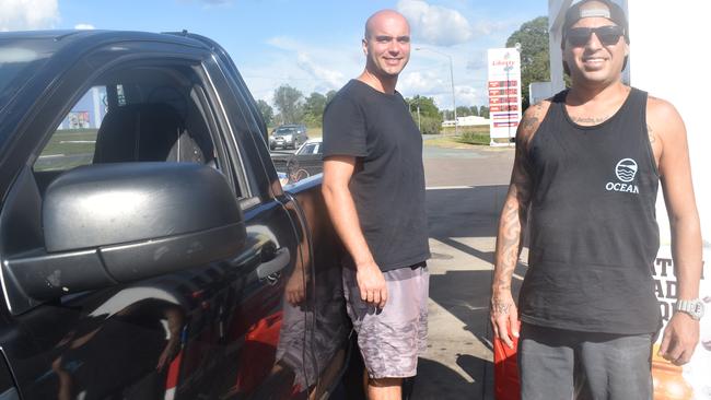 CHEAP FUEL: Pressure cleaning contractors Victor Santos and Mercio Cruz took advantage of almost unbelievably cheap petrol and diesel fuel in Gympie yesterday, when they bought petrol and diesel for their ute and equipment at the Liberty service station on the Bruce Highway.