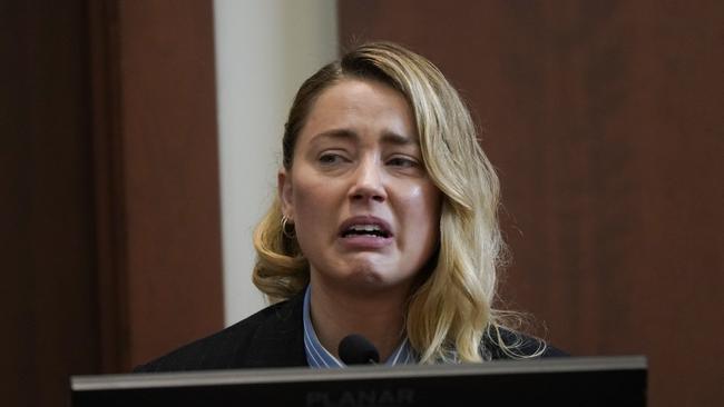 Actor Amber Heard testifies about the first time her ex-husband, actor Johnny Depp hit her, at Fairfax County Circuit Court during a defamation case against her by Depp in Fairfax, Virginia.