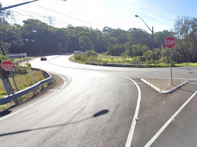 The stop sign at the intersection of The River Road and Henry Lawson Drive at Revesby.