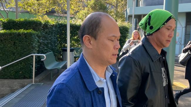 Eric Phu Soksan, 46, (left) of Terrigal, arriving at Gosford Local Court where he was sentenced for sexually touching. Picture: Richard Noone